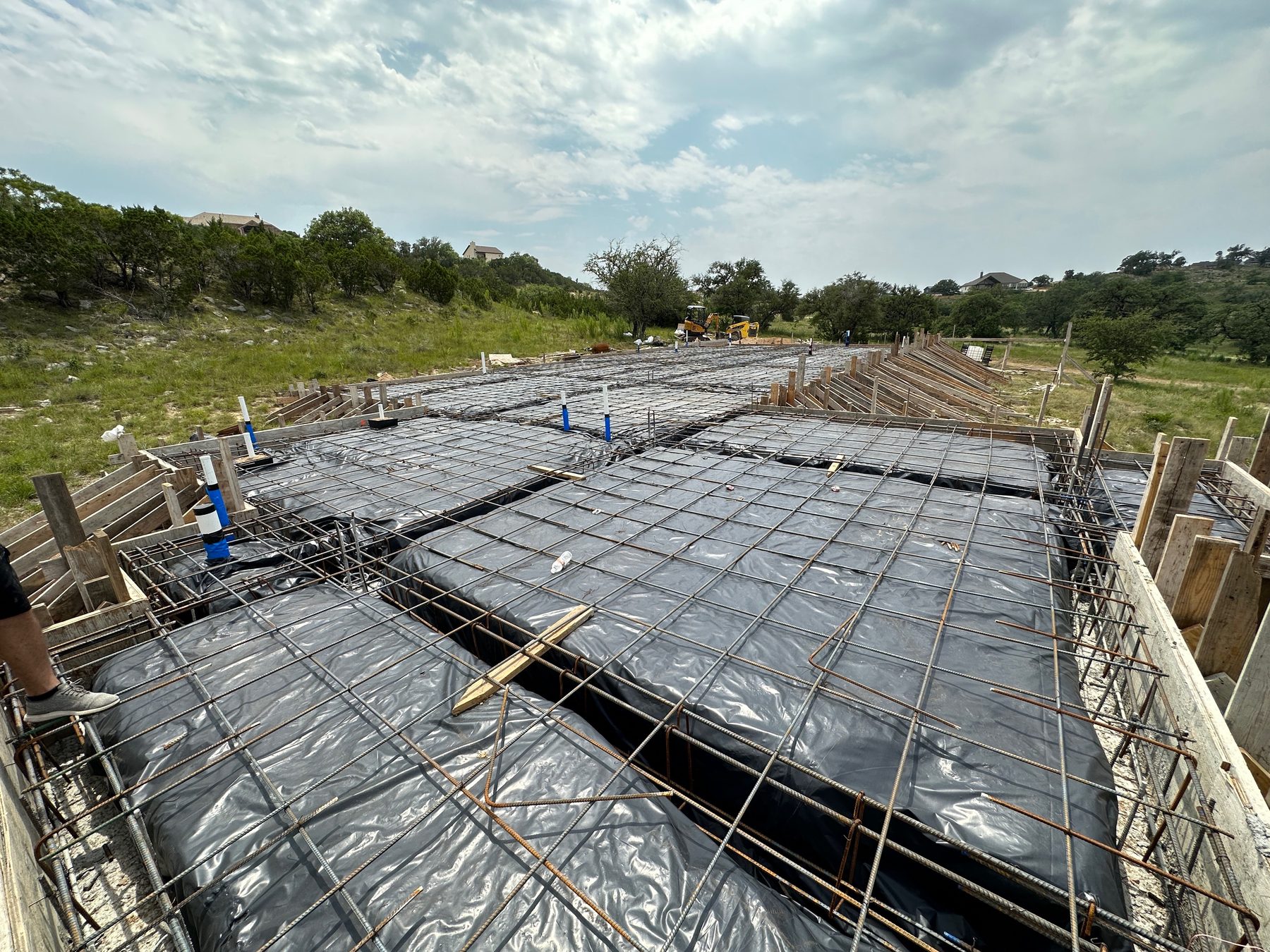 Forms and rebar on a hill with a view