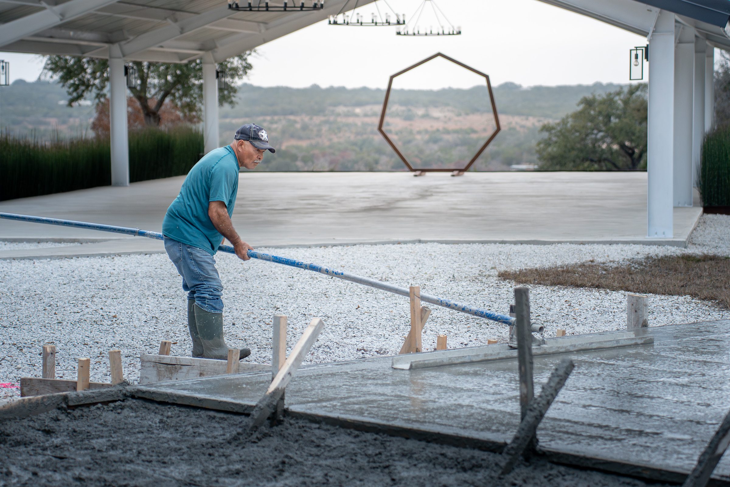 Screeding the pad beneath the covered pavilion