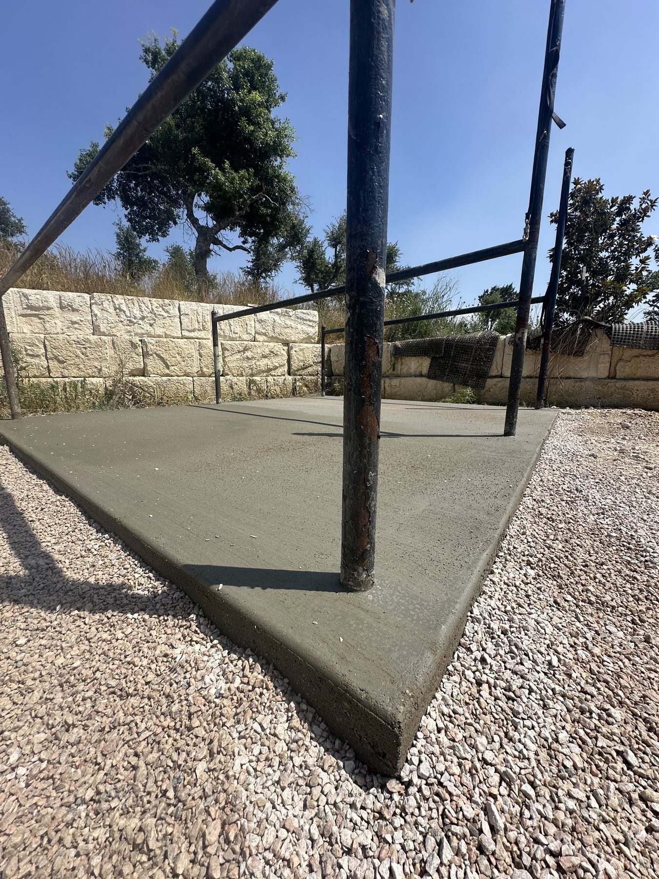 Fresh pad poured around a steel post
